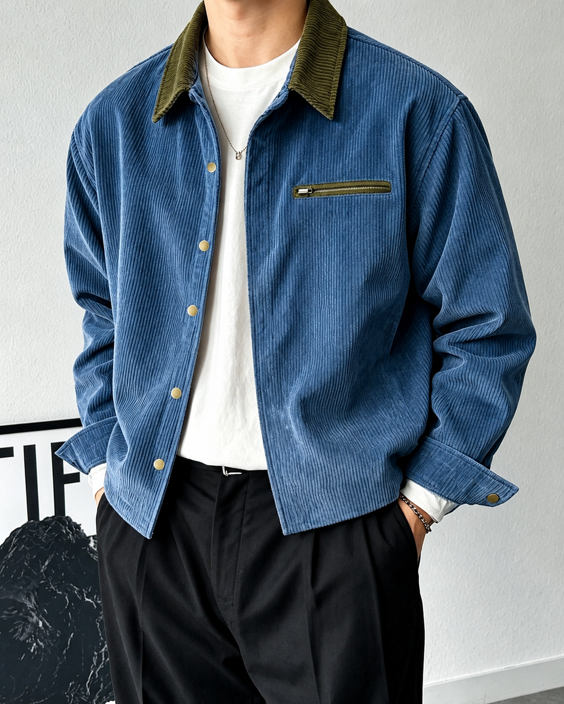 Side view of a men's corduroy shirt jacket showing its relaxed shape.
