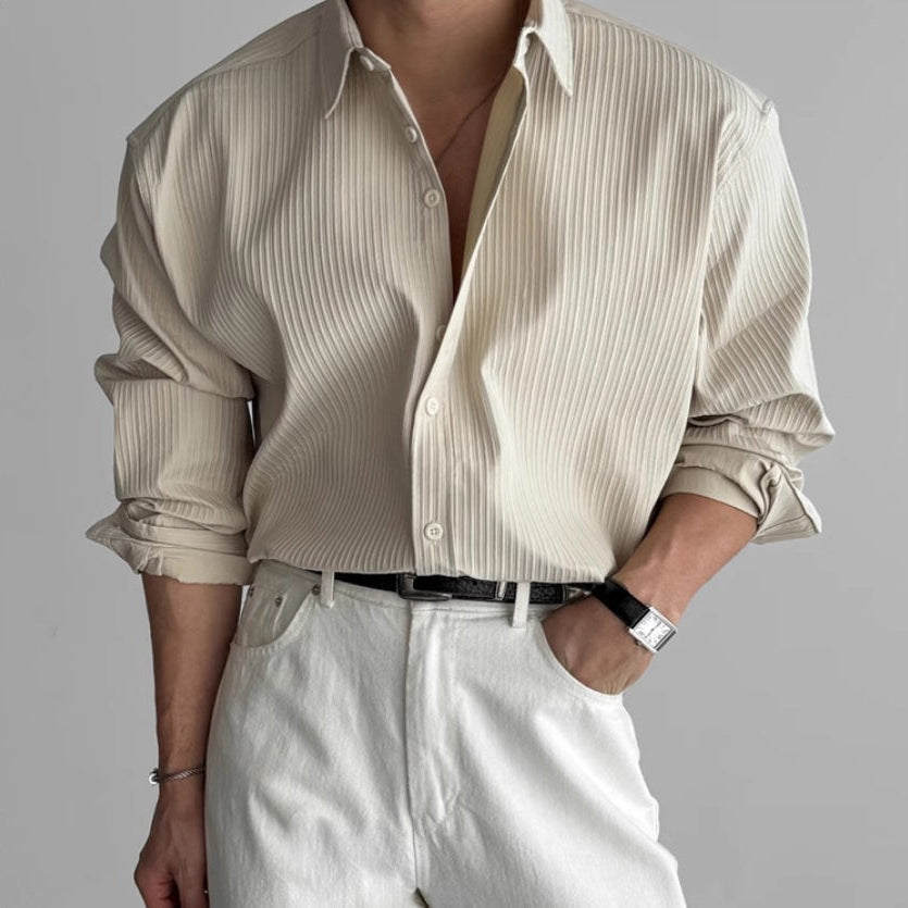 Close-up of pleated detailing on a minimalist men's shirt