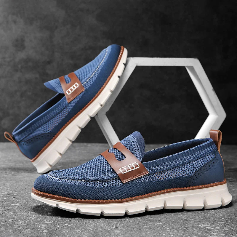 Pair of men's penny loafers shown from the side