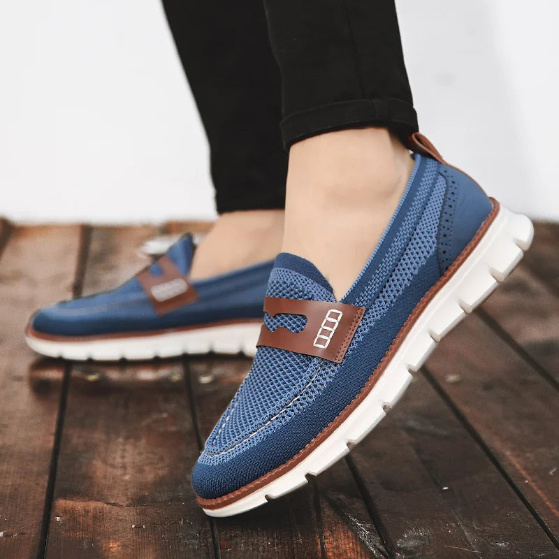 Men's penny loafers displayed at a three-quarter angle