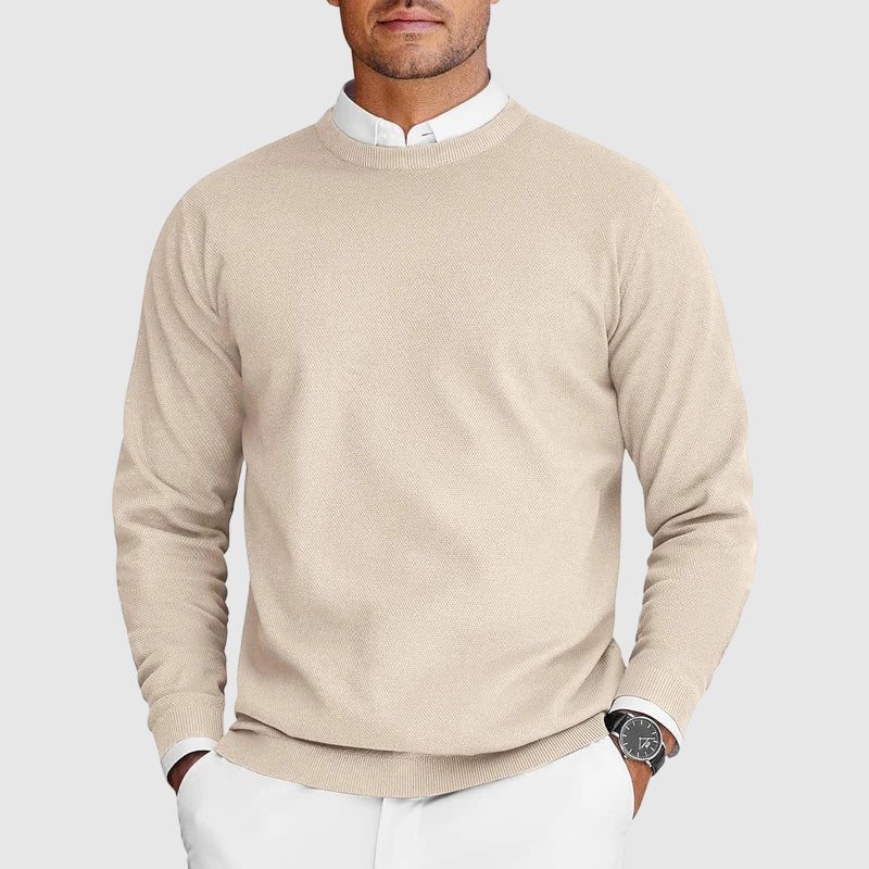 Close-up of the crew neck and knit texture on a men's sweater