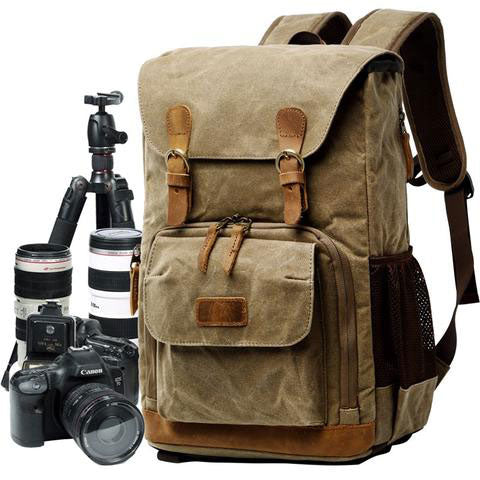 Top view of the vintage camera backpack showing handle and zipper closure