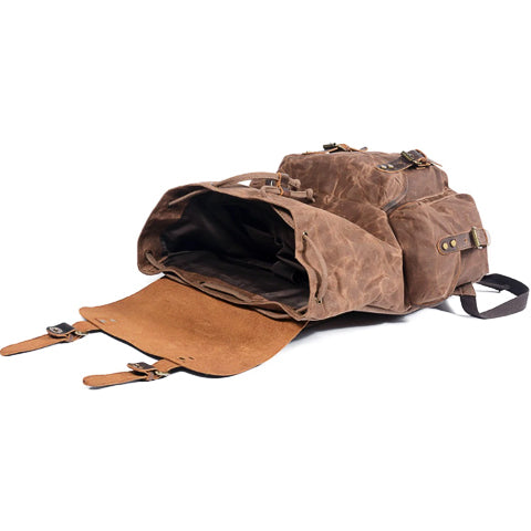 Open vintage canvas backpack showing spacious interior storage