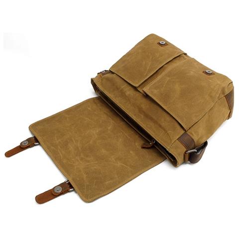 Detailed view of the men's crossbody bag flap and front exterior finish