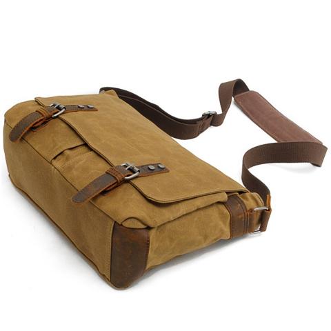 Men's vintage shoulder bag shown with strap hardware and buckle detail