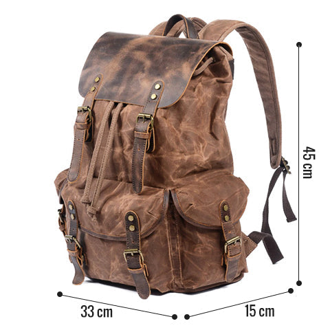 Canvas travel backpack with adjustable shoulder straps and top handle