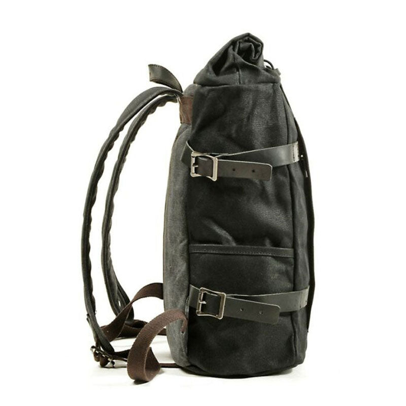 Vintage motorcycle backpack with flap and buckle details in a close-up view