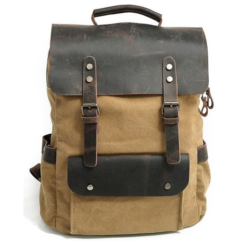 Vintage canvas leather backpack opened to show interior space