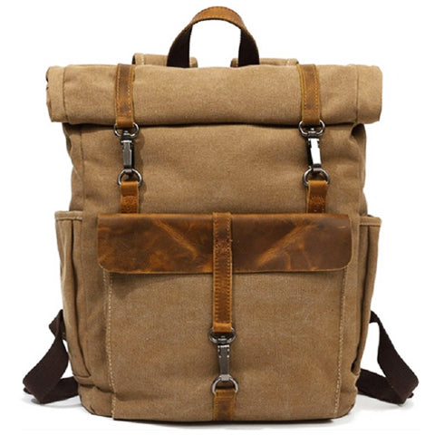 Open vintage canvas backpack displaying spacious main compartment and interior storage