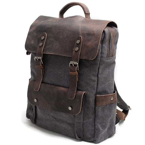Close-up of leather trim and canvas texture on backpack