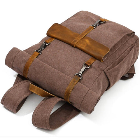 Detailed view of the backpack hardware, stitching, and canvas texture