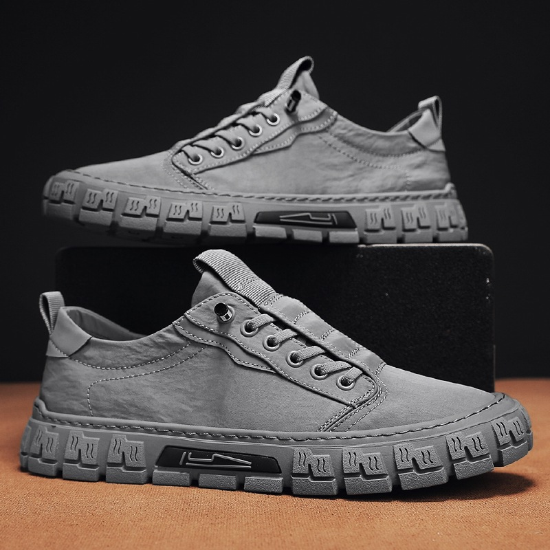 Side view of men's suede-like canvas sneakers with durable rubber soles
