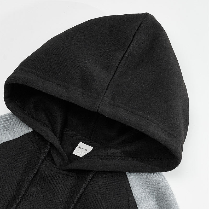 Close-up of the textured contrast panel detail on the hoodie