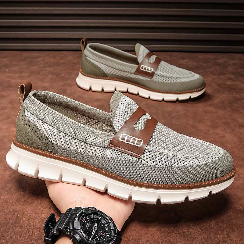 Pair of men's dress loafers with penny loafer styling