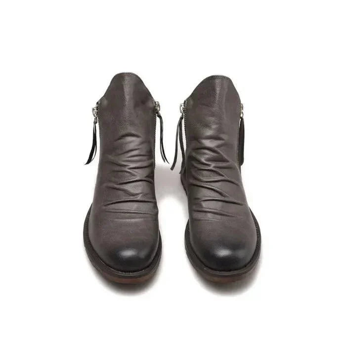 Men's leather boots shown at a three-quarter angle