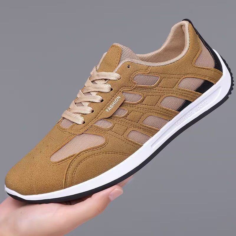 Pair of men's suede sneakers shown from the side
