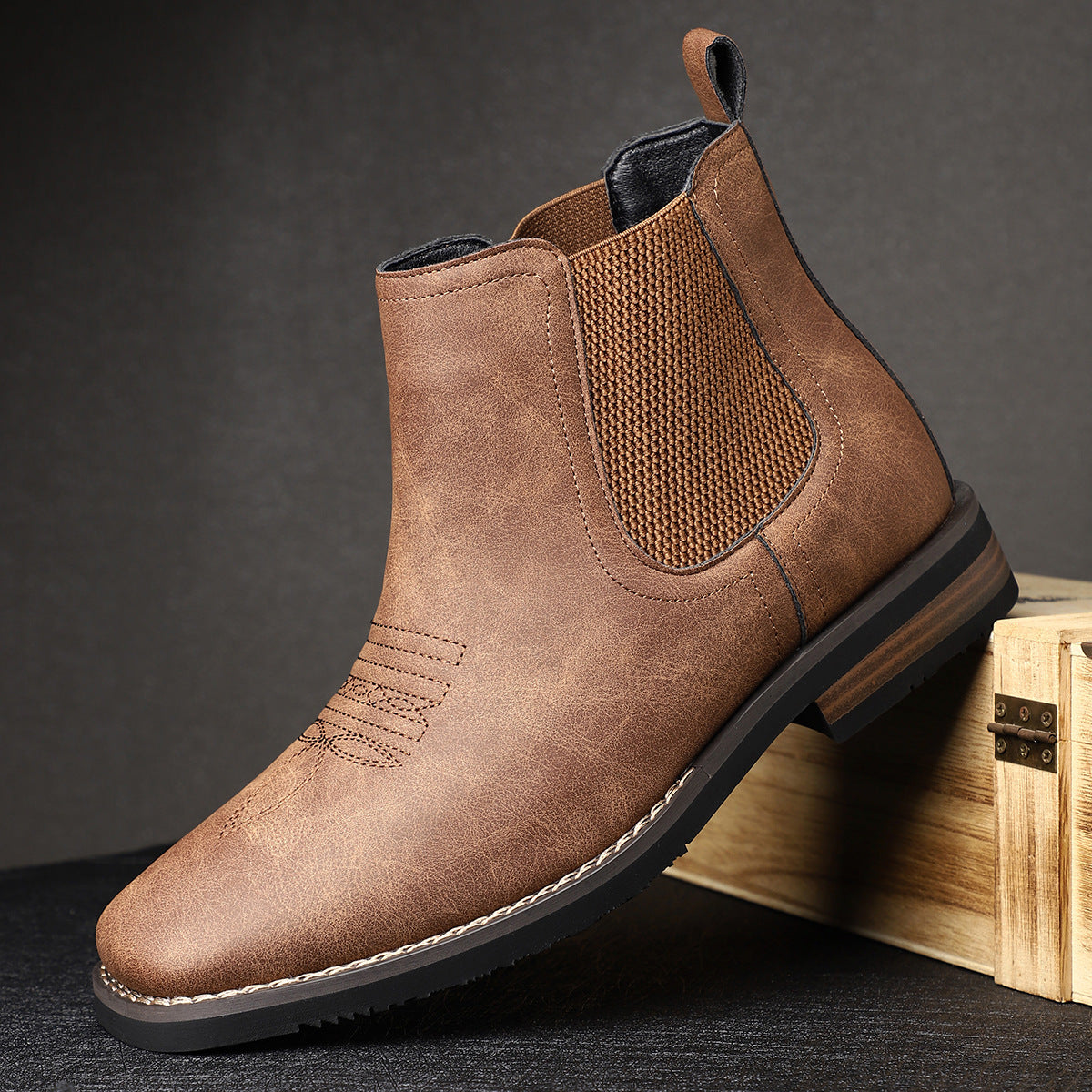 Pair of men's leather boots displayed at an angle