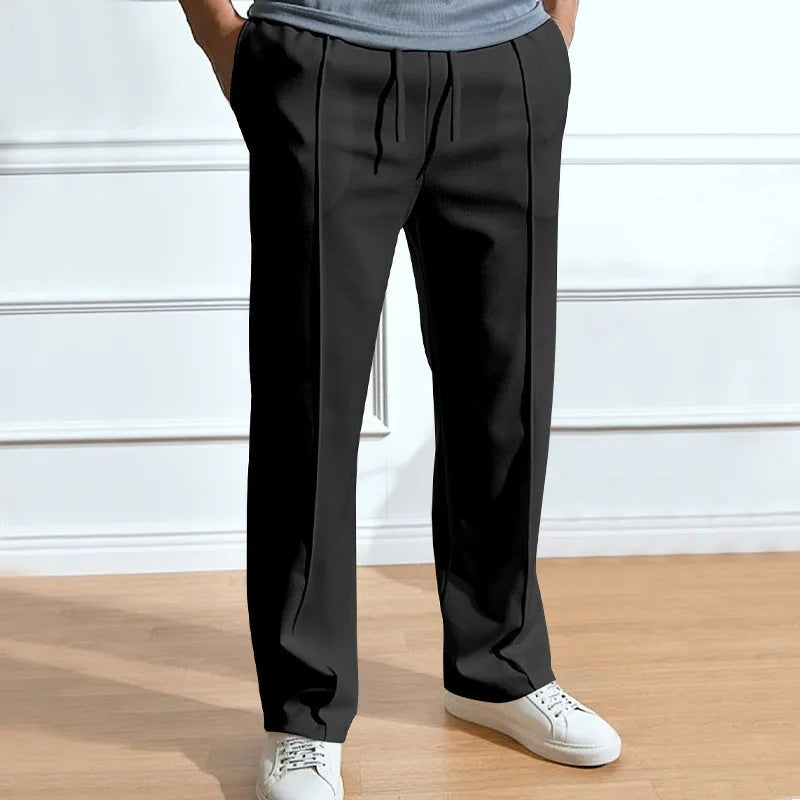 Men's slim-fit trousers shown from the back with a flexible fit