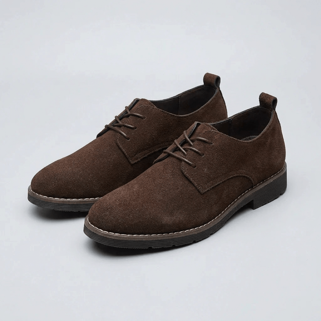 Side view of a men's Oxford dress shoe with refined stitching and a low heel