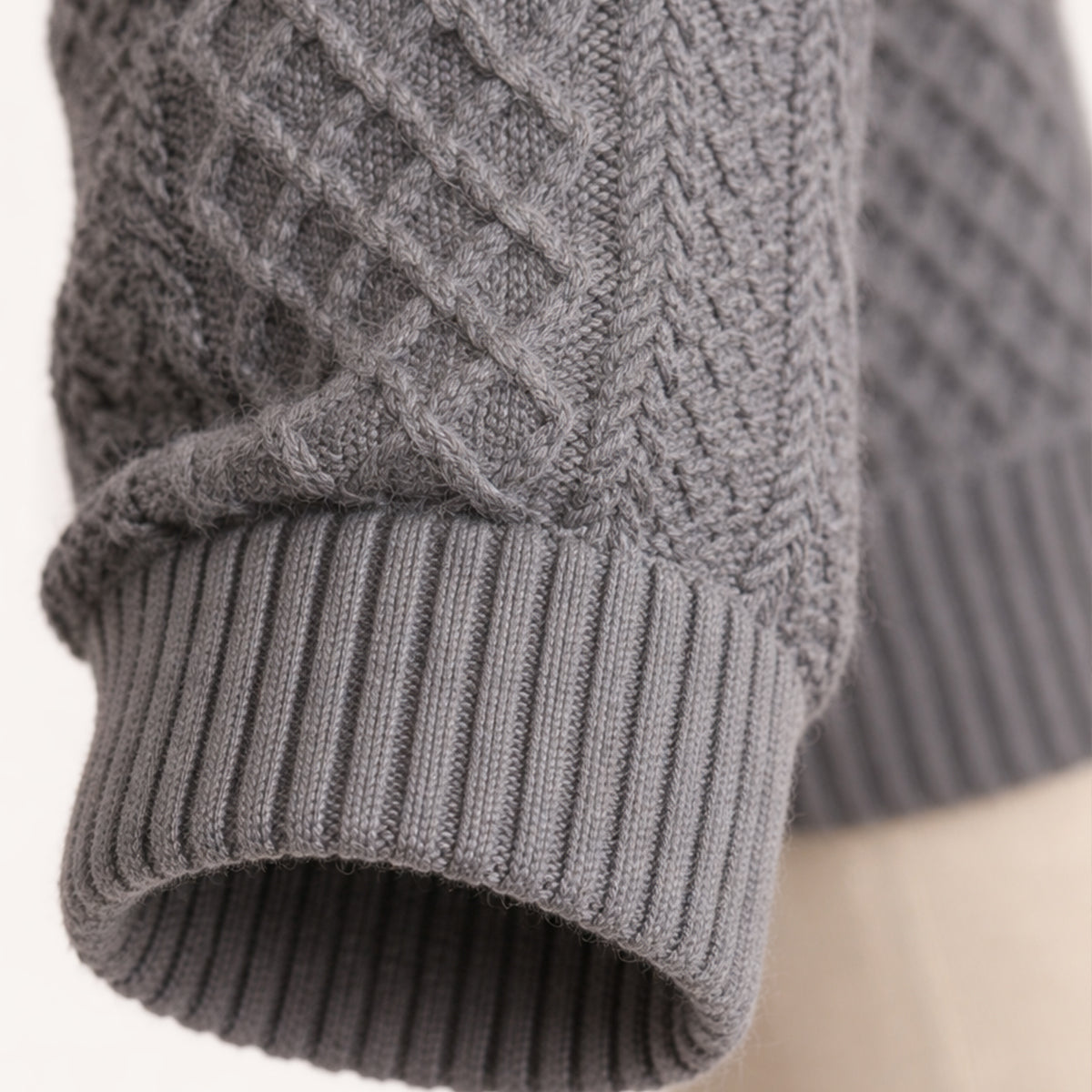 Side view of the men's cable-knit cardigan