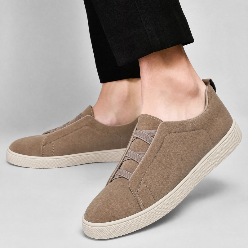 Men's suede sneaker showing the rounded toe and textured upper