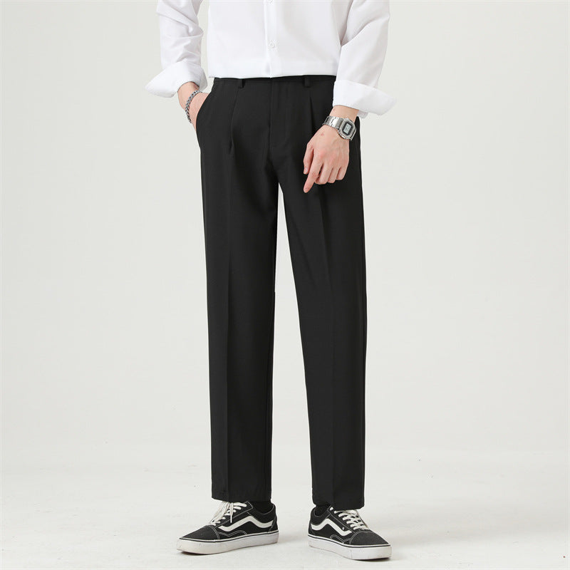 Men's pleated dress pants featuring a crisp straight-leg silhouette