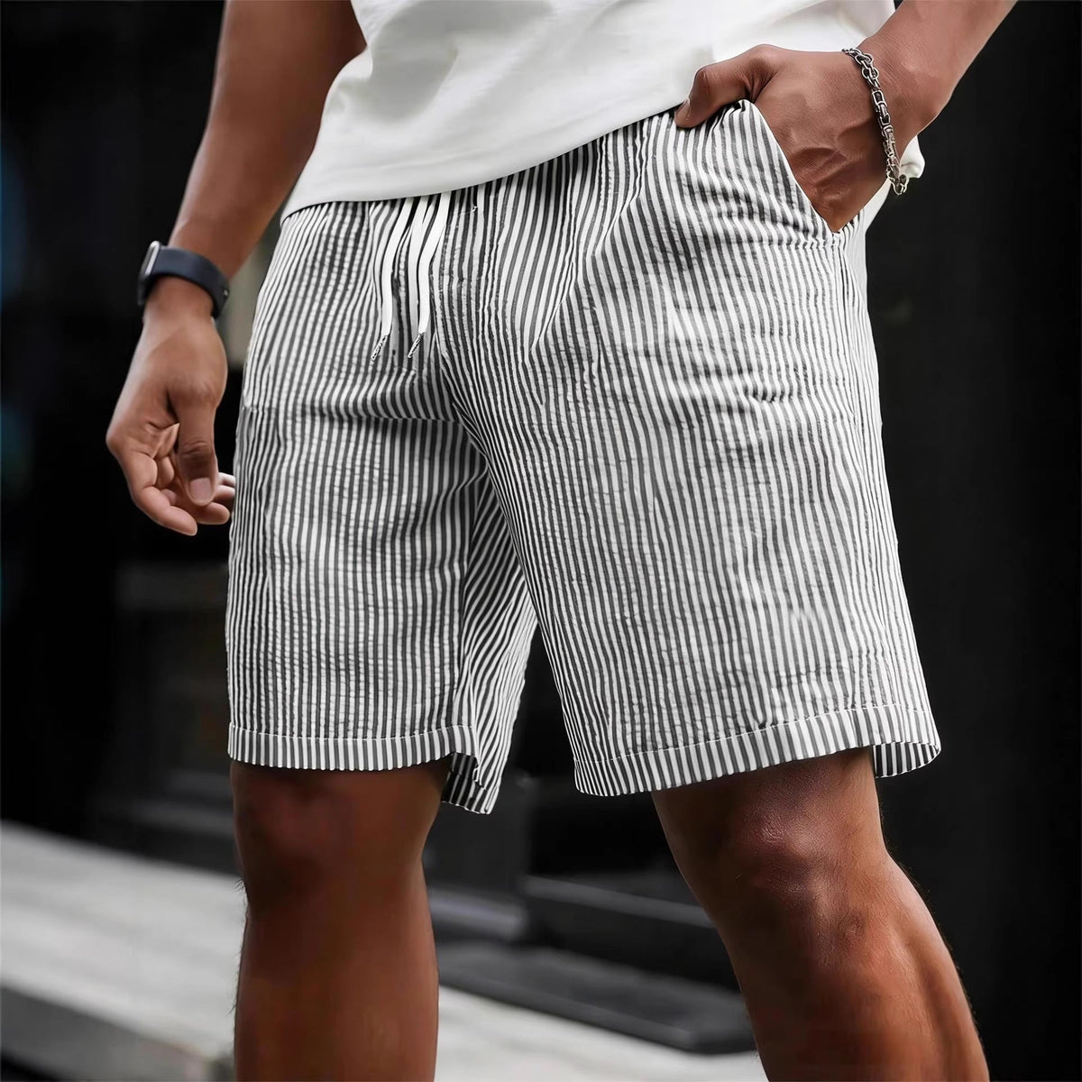 Close-up of the drawstring waist on men's striped shorts