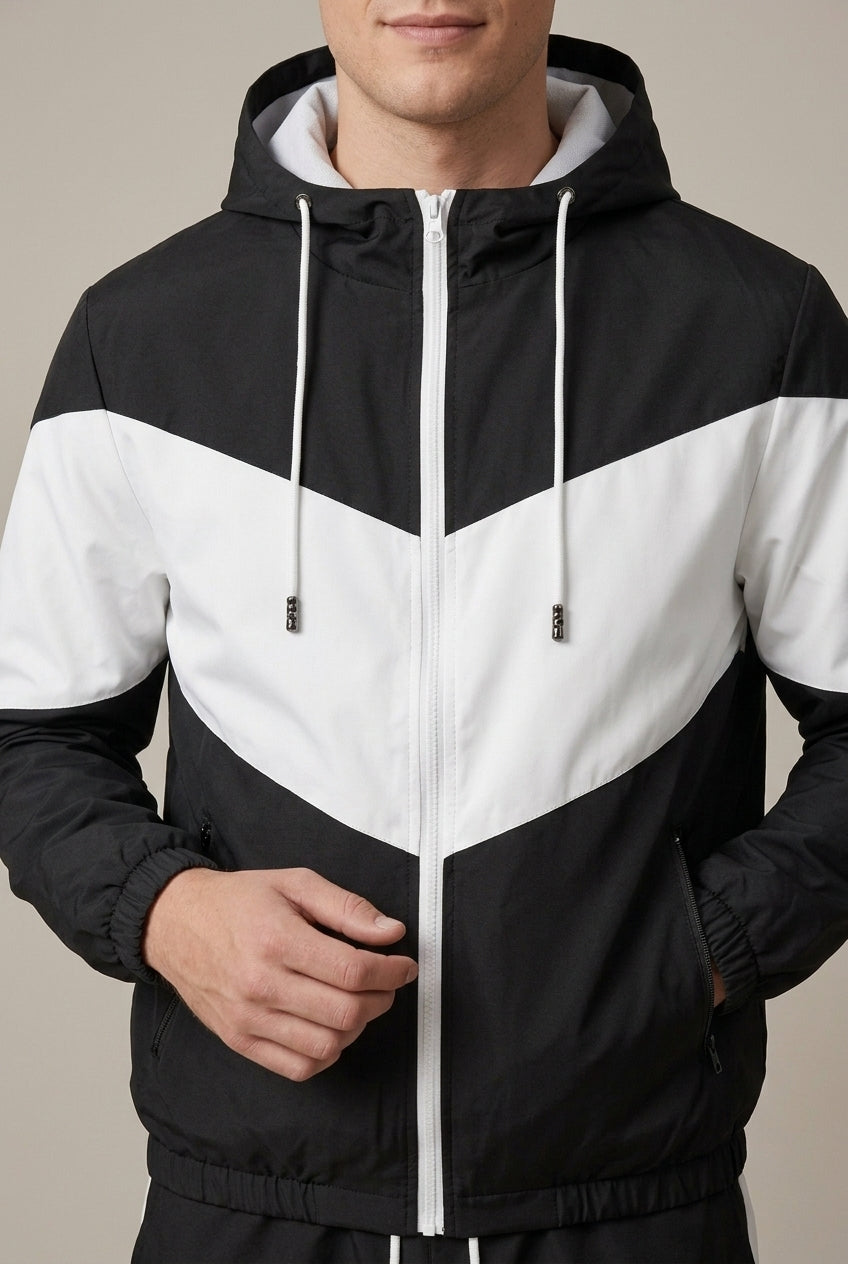 Front view of men's hooded track jacket with contrast panels and matching joggers