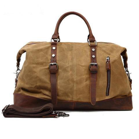 Side view of the vintage leather travel duffle bag with carry handles