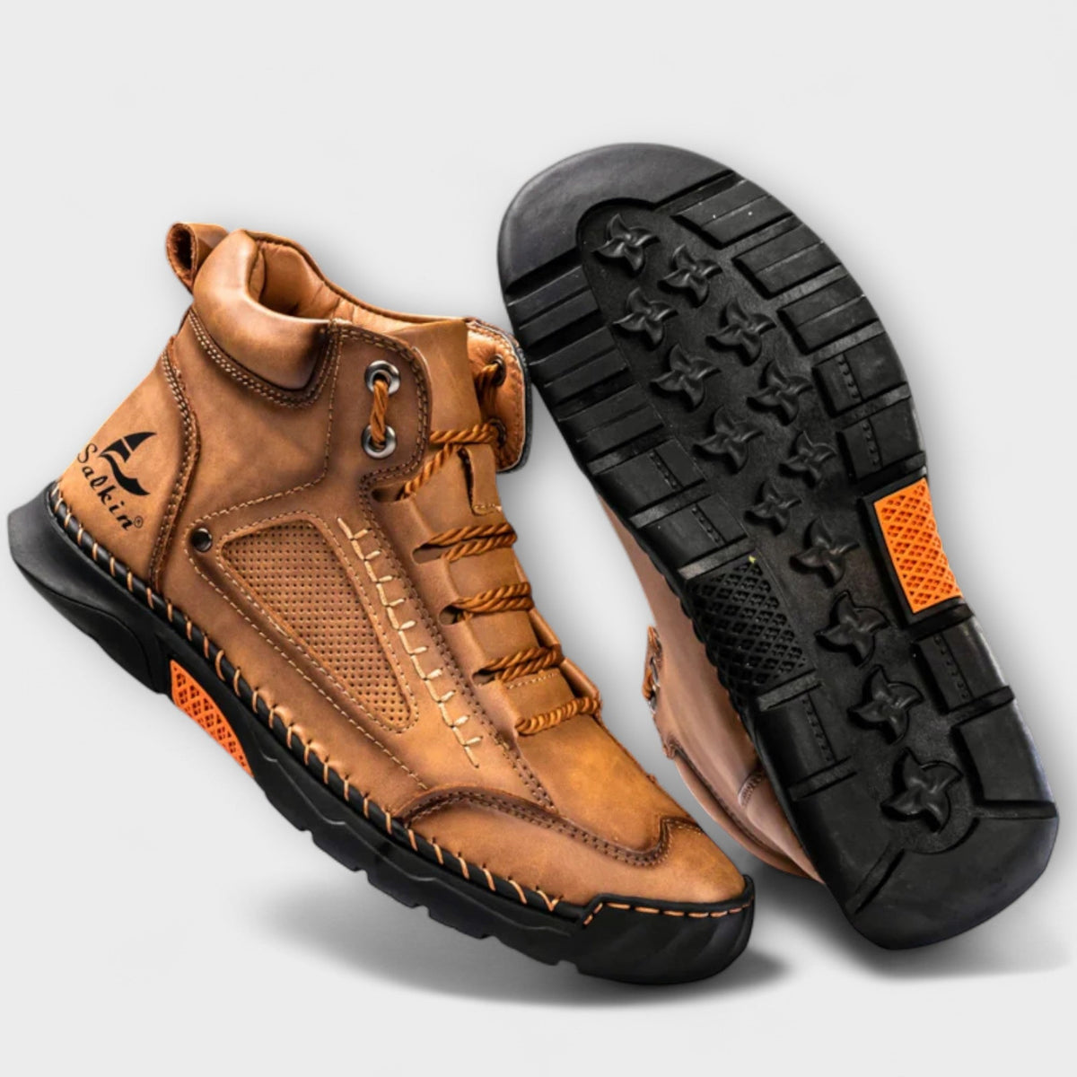 Front view of classic men's leather boots with a structured design