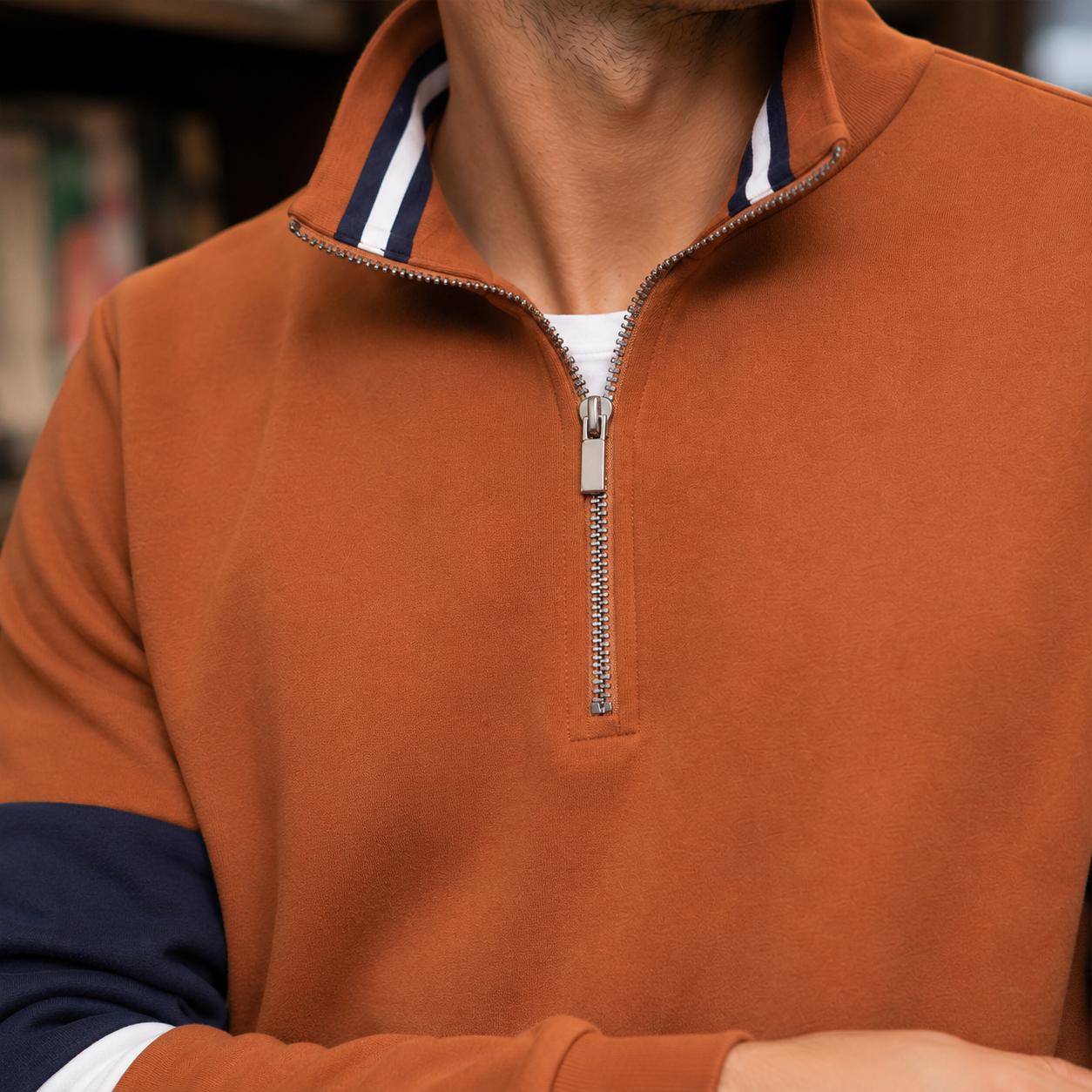 Close-up of the quarter-zip collar and cotton-blend knit texture