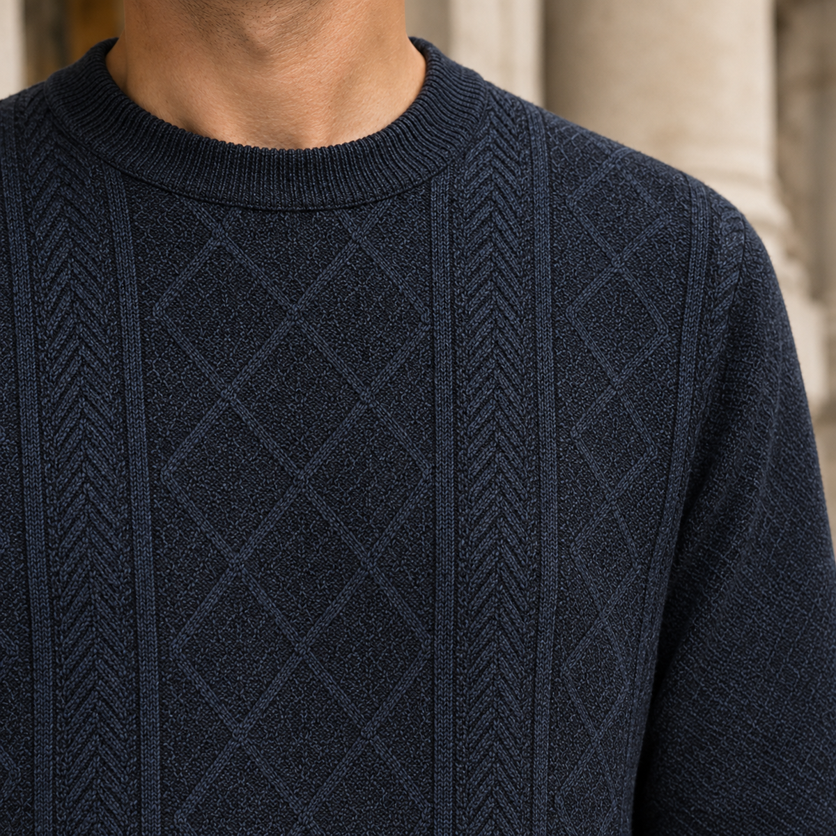 Close-up view of the sweater's textured knit construction