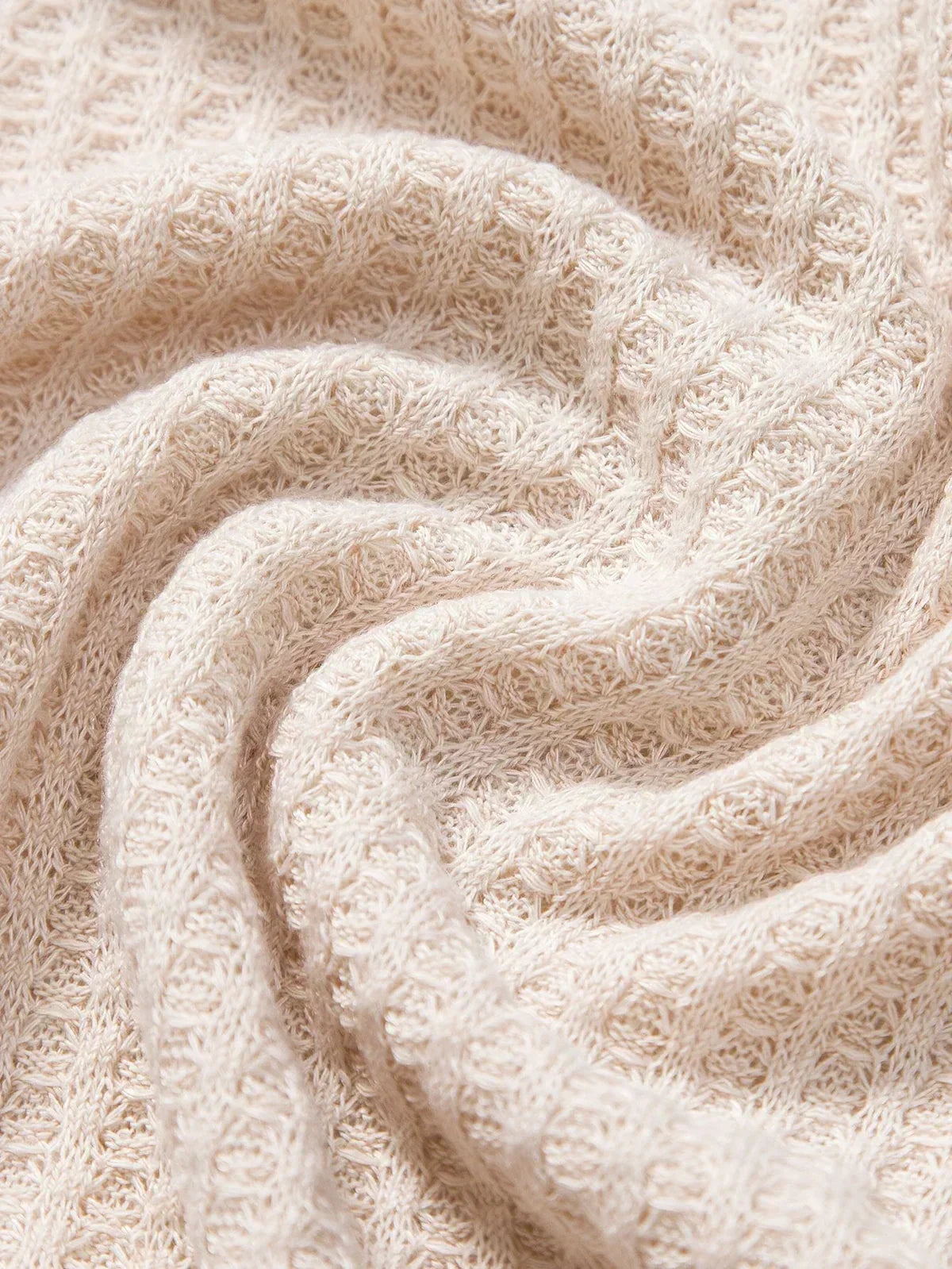 Detail view of the men's polo shirt fabric and stitching
