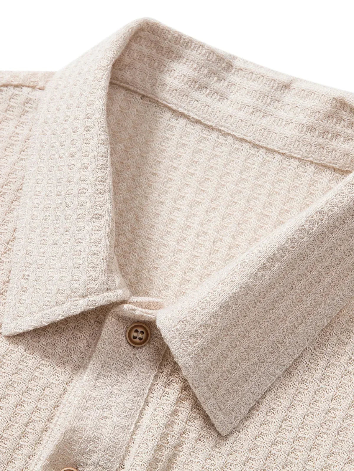 Close-up of the men's polo shirt collar and button placket