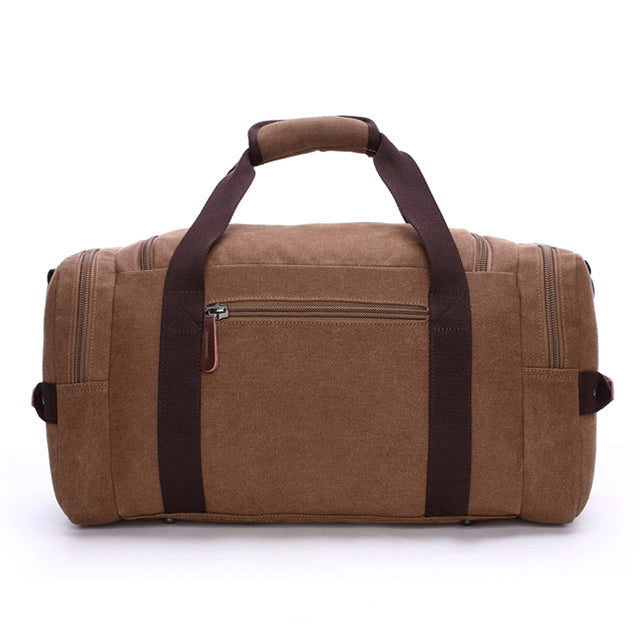Side view of large travel work bag showing structured canvas body and trim