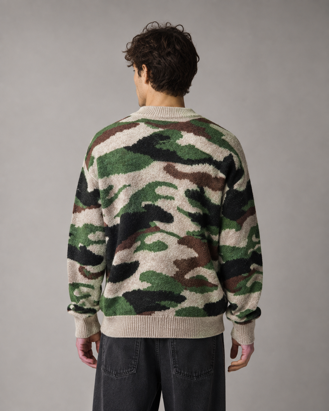 Front view of a men's camouflage knit streetwear sweater