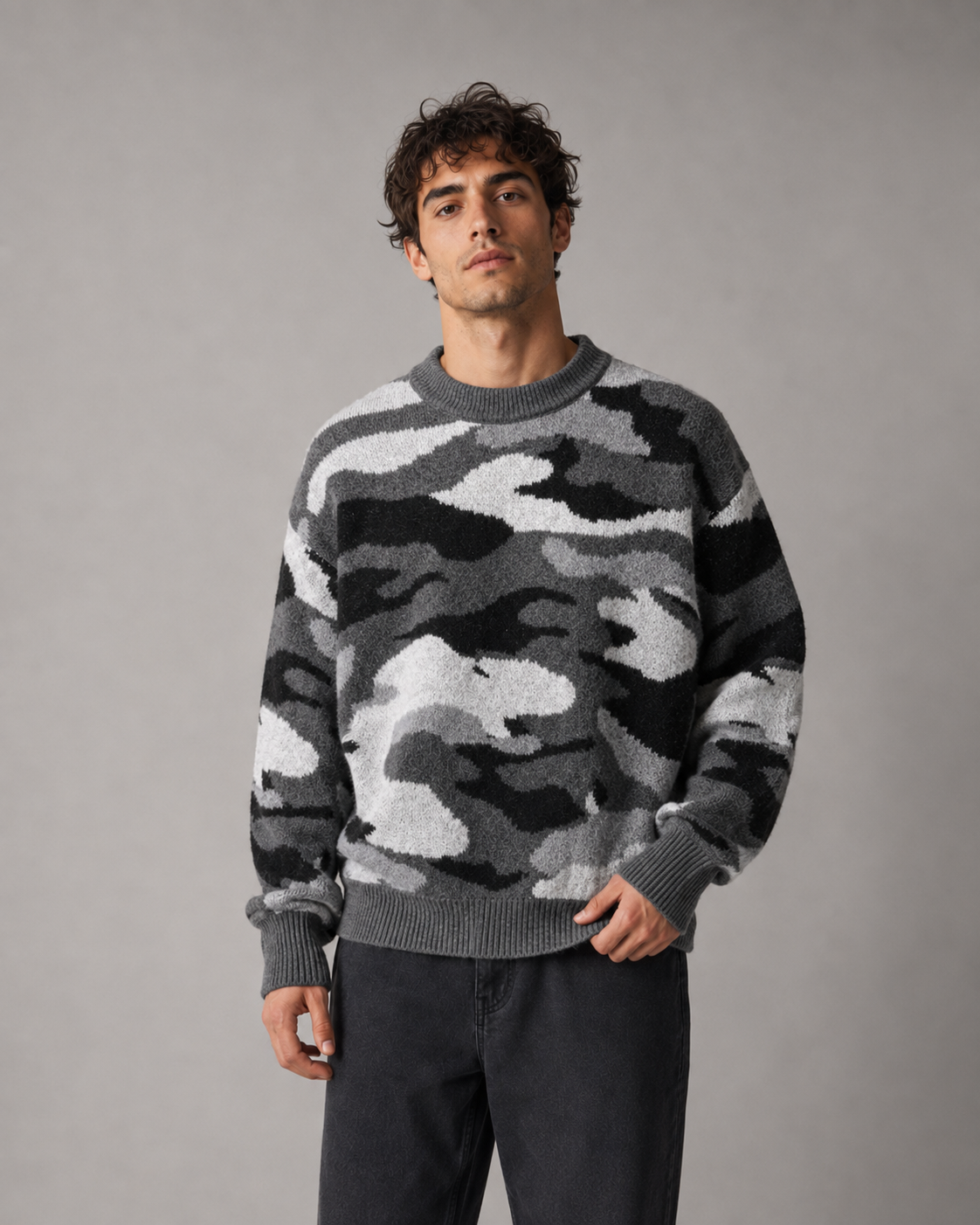 Side view of a men's camouflage sweater with a relaxed fit