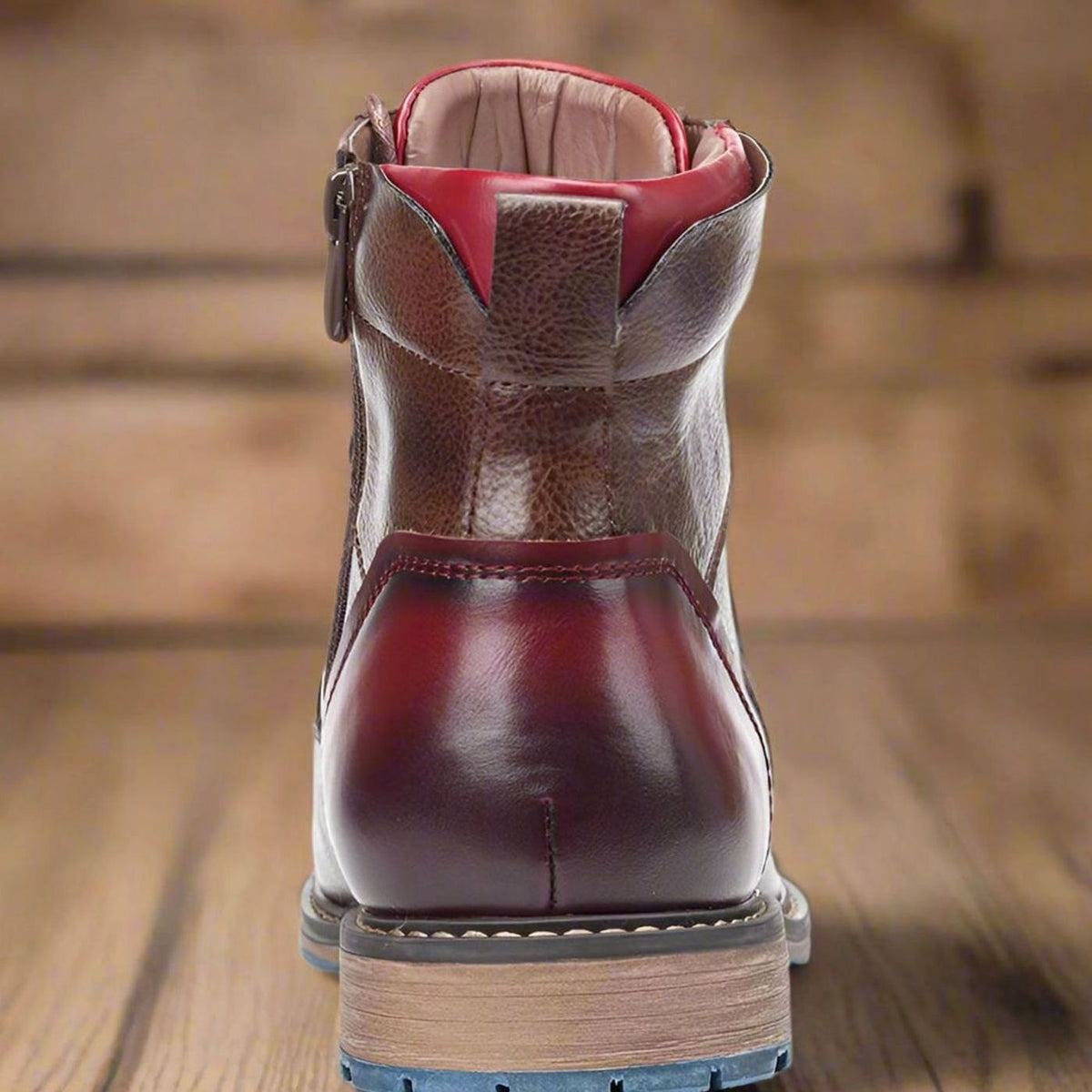 Front view of polished leather cap-toe ankle boots for men