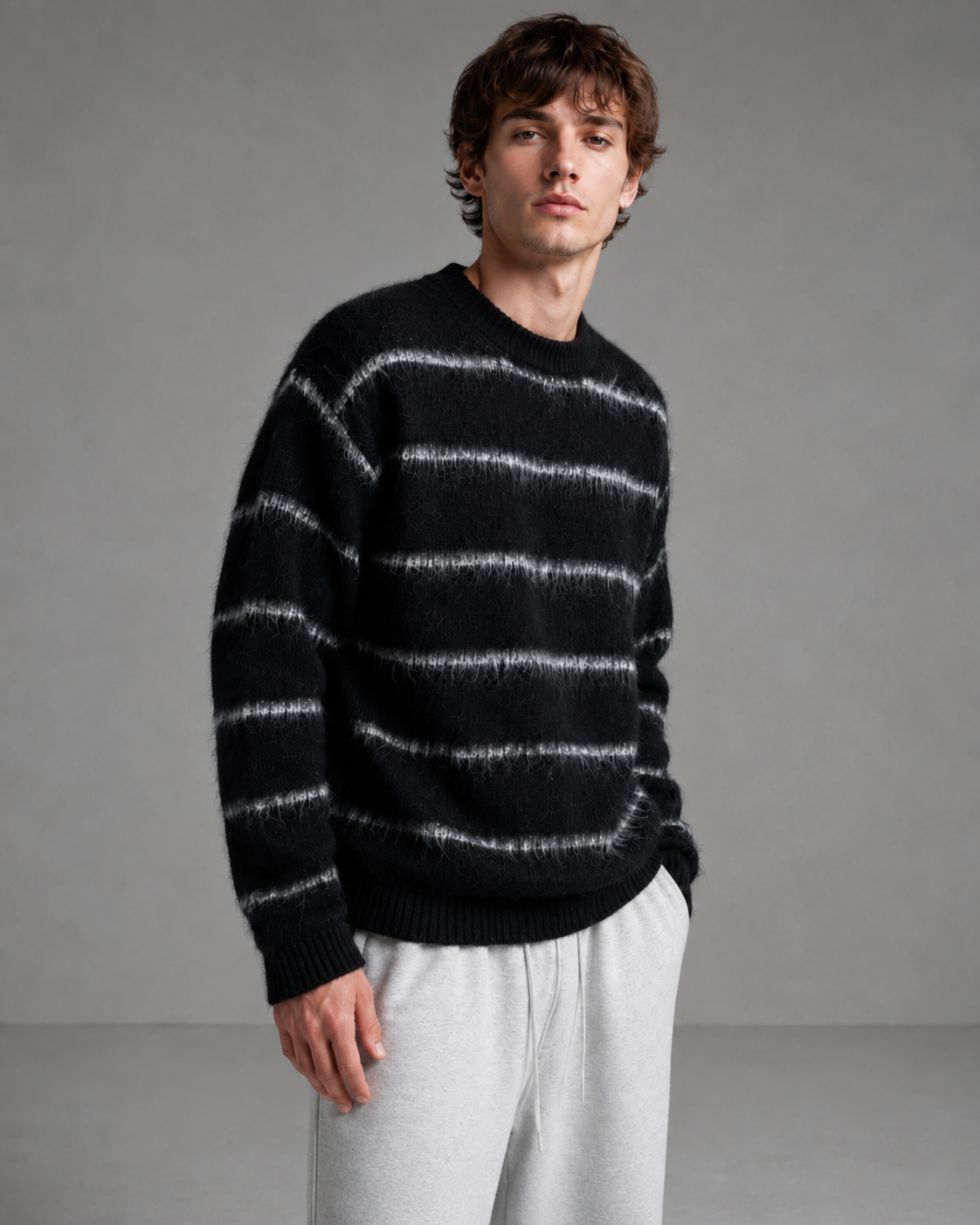 Close-up of the fuzzy striped knit texture on a men's sweater