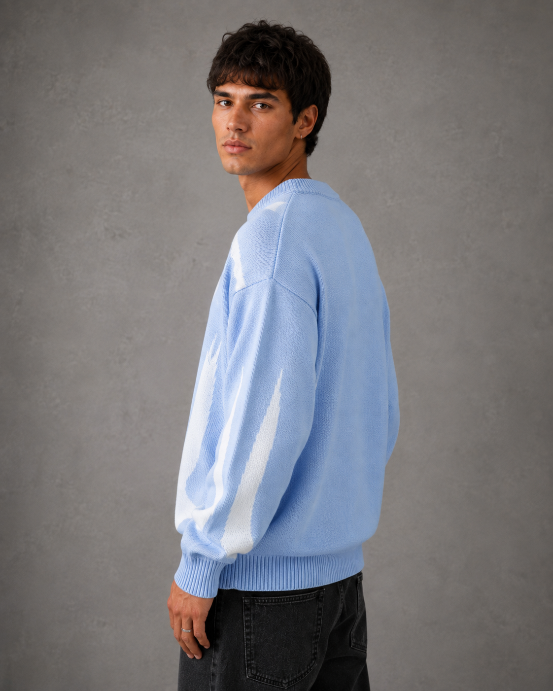 Close-up view of the graphic knit texture on a men's sweater