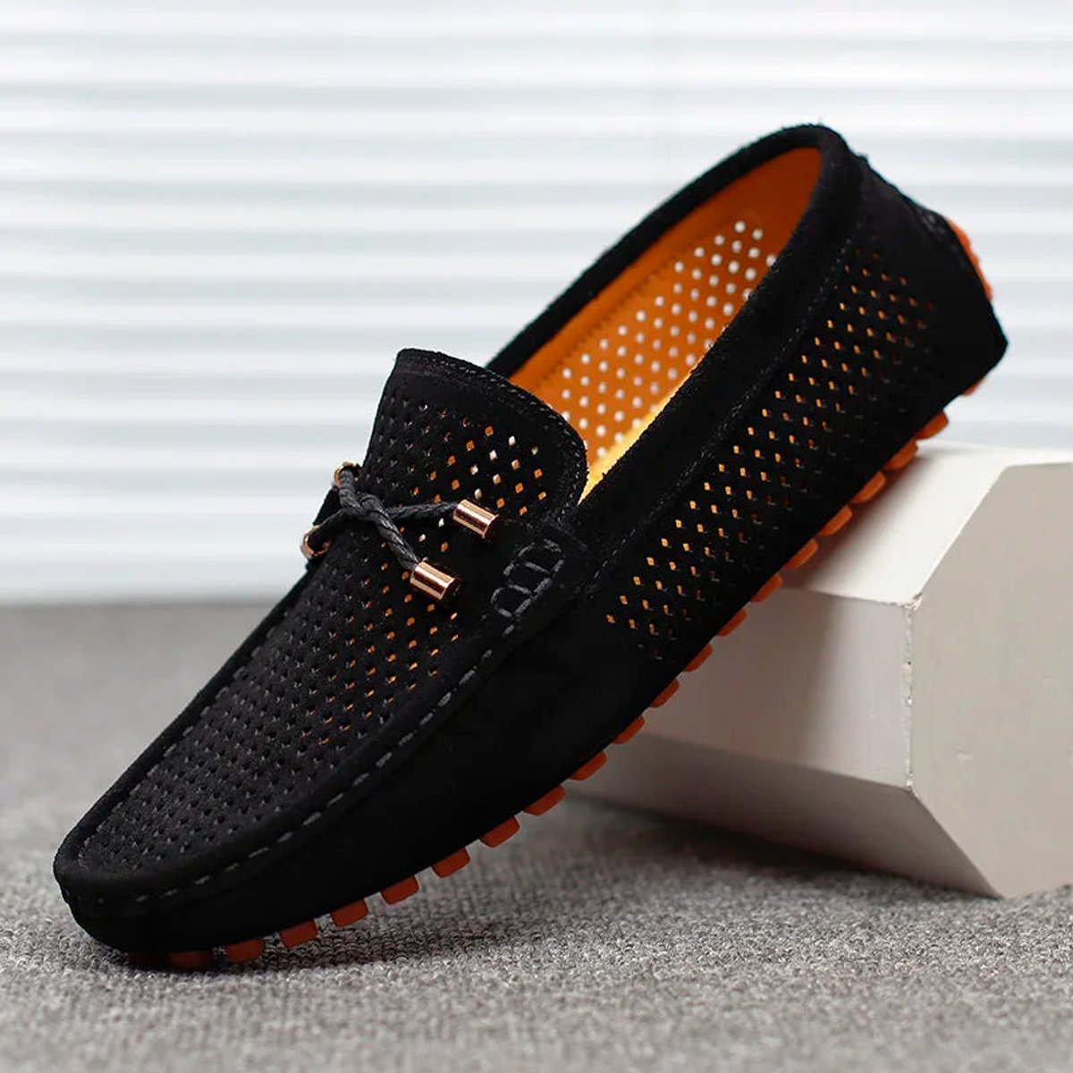 Side profile of a men's driving loafer with a flexible sole