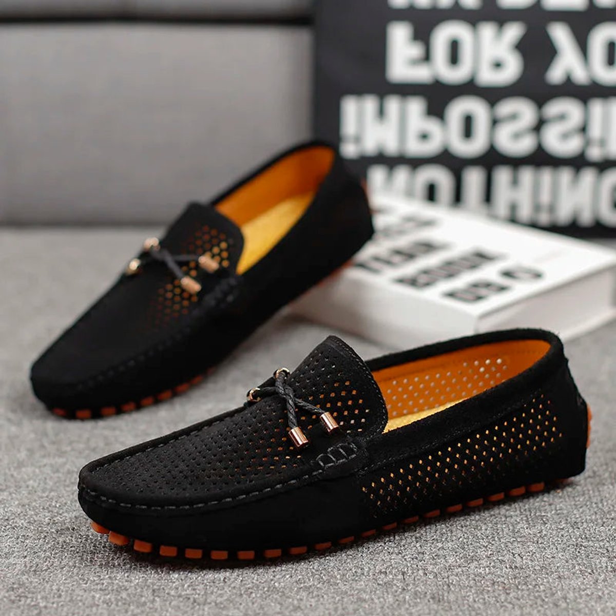 Bottom view of a men's driving loafer showing the textured sole
