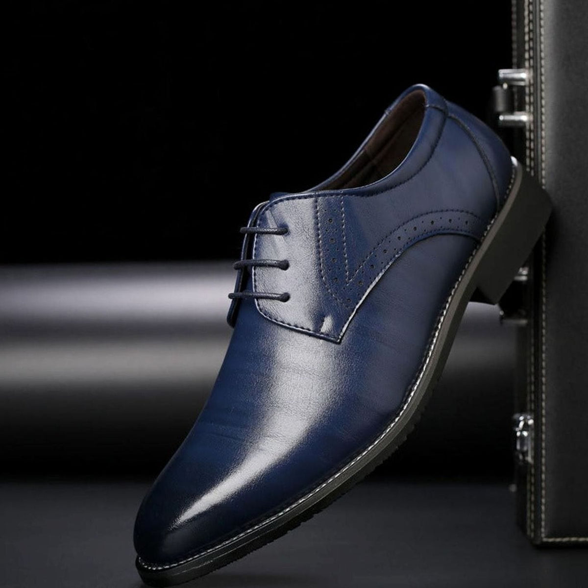 Men's leather brogue dress shoes with classic perforated detailing