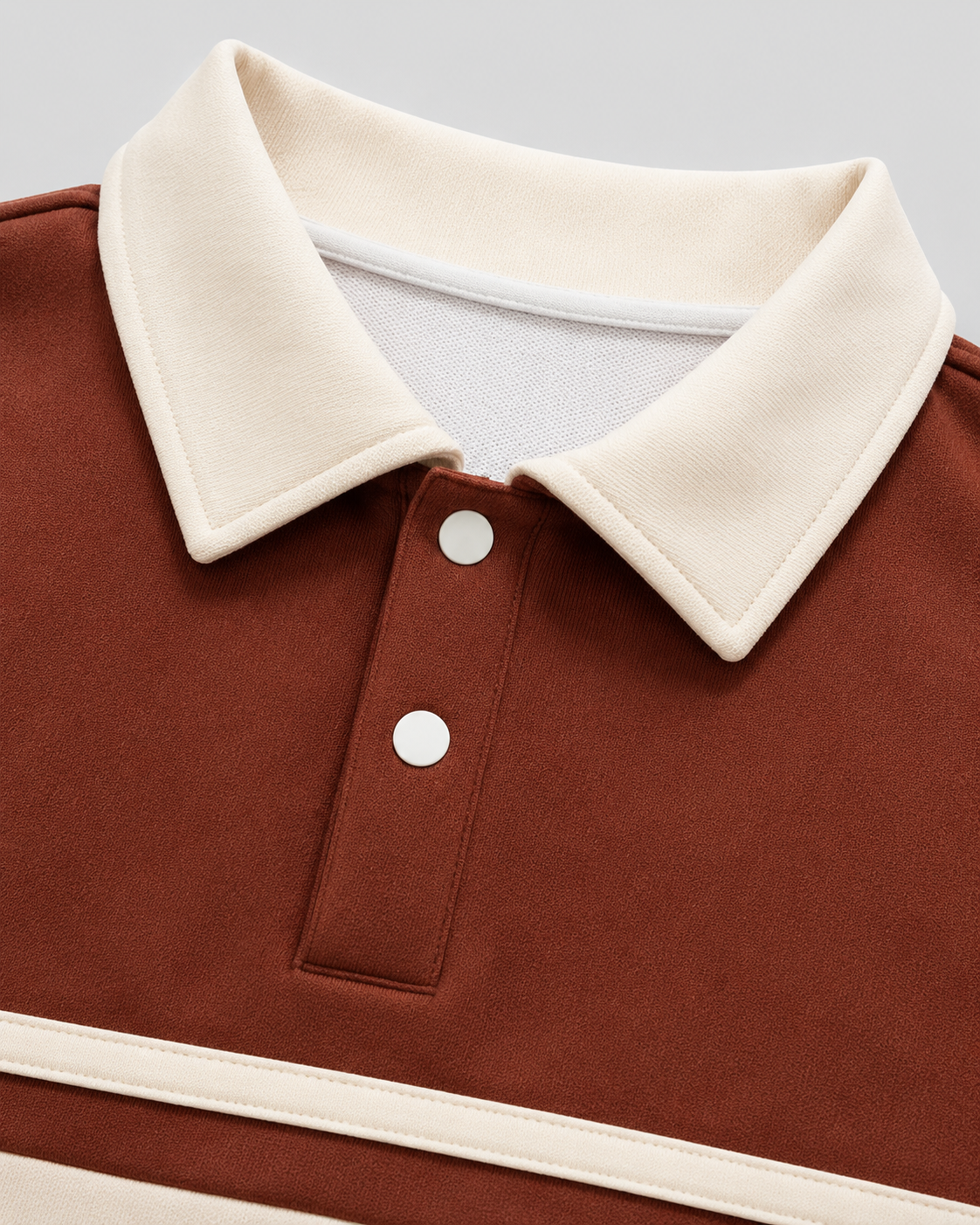Close-up of the polo collar and button placket on a men's sweater