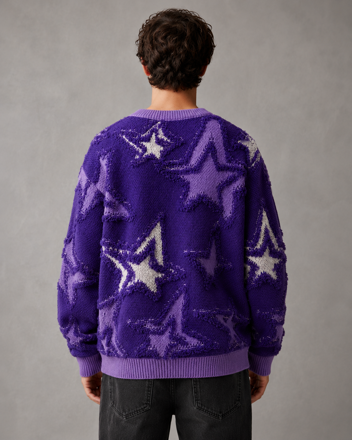 Close-up view of the textured star knit pattern on the sweater