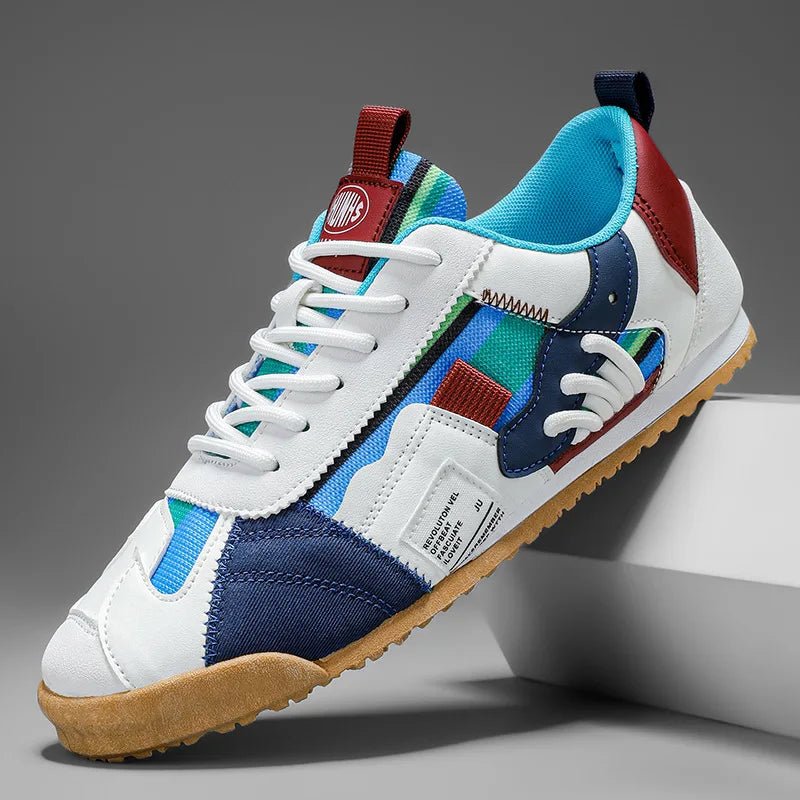 Men's trail sneaker with layered suede and mesh upper shown from the side