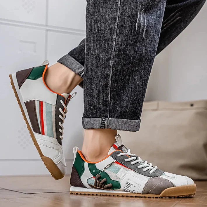 Detailed view of the mesh panels on a men's athletic trail sneaker