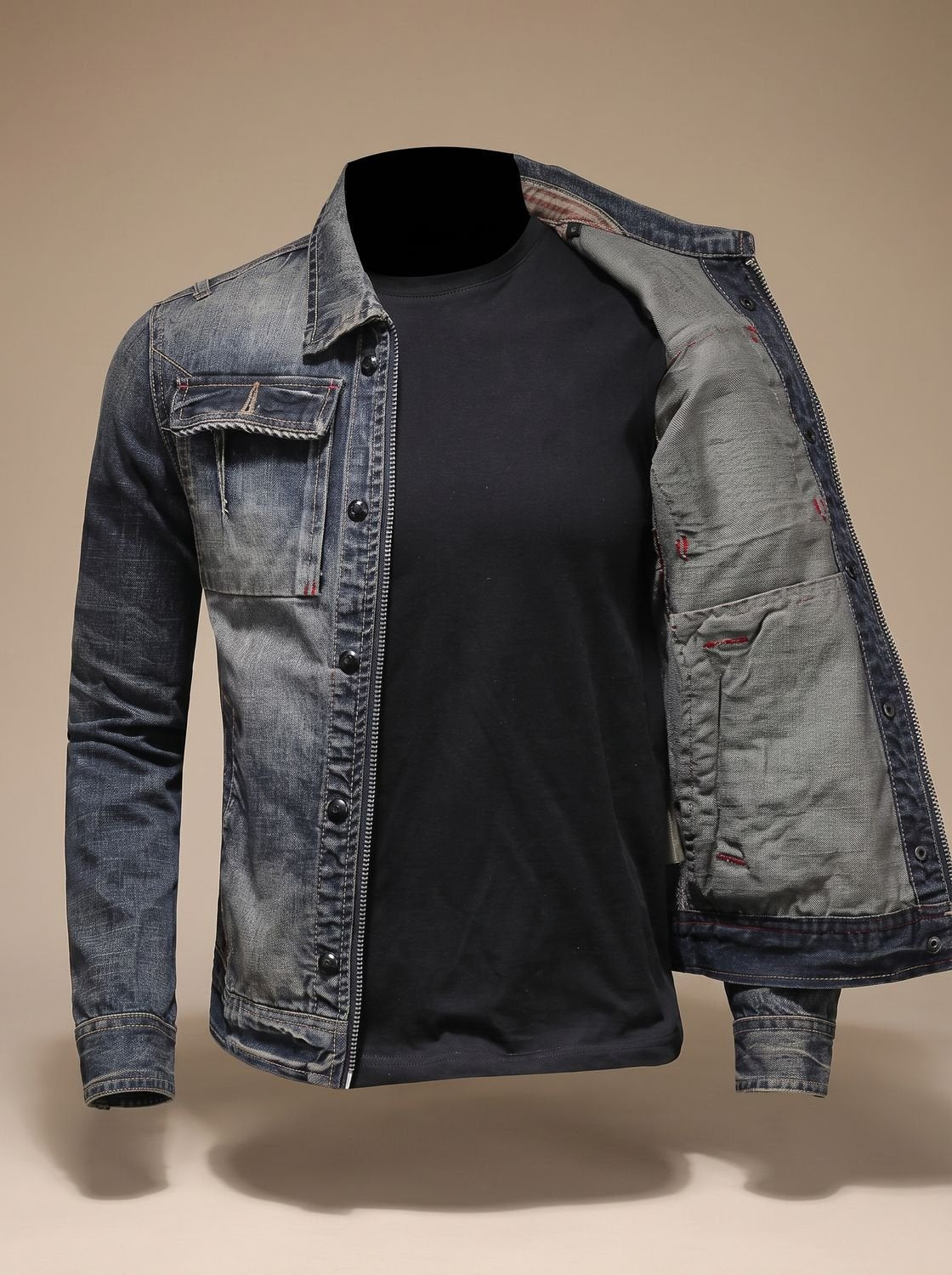 Close-up of the denim trucker jacket's vintage-washed texture and front closures