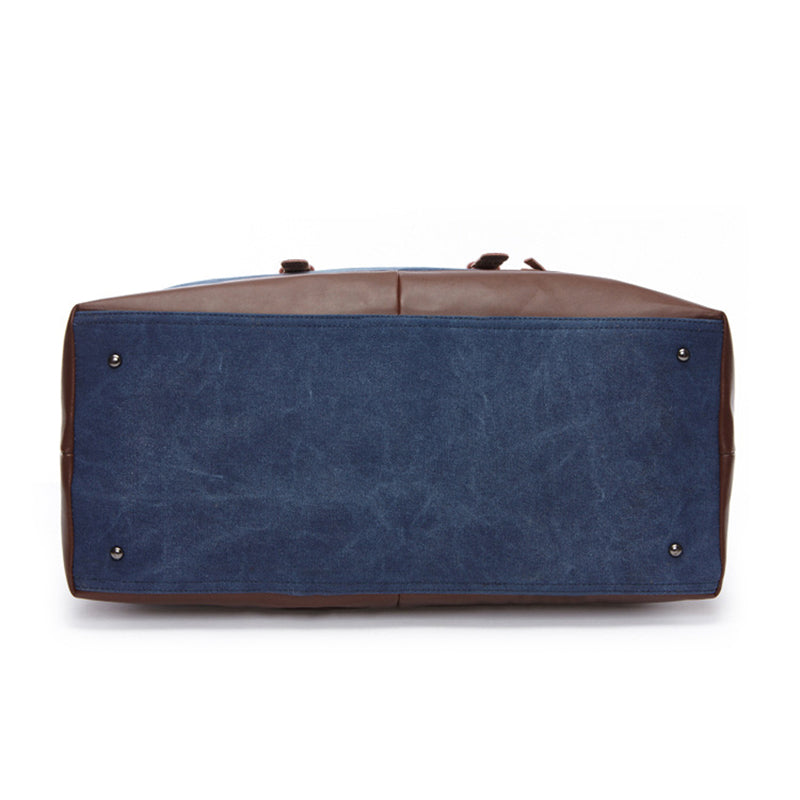 Vintage leather canvas duffle bag styled for travel and work with classic rugged details