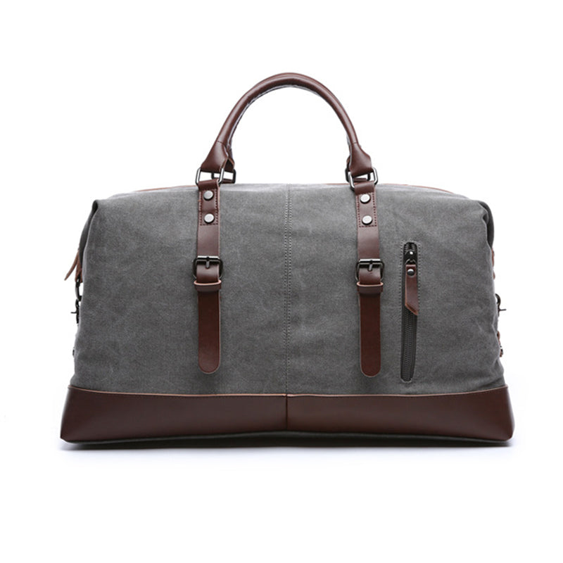 Spacious vintage duffle bag in canvas and leather shown from an angled side view
